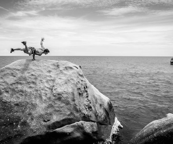 Man performing a controlled strength exercise in a calm environment.